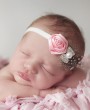 Pink satin rose with beautiful guinea feather, pearl and diamante bow rhinestone on a soft elastic headband