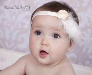 Ivory satin rose with marabou feather and rhinestone flower