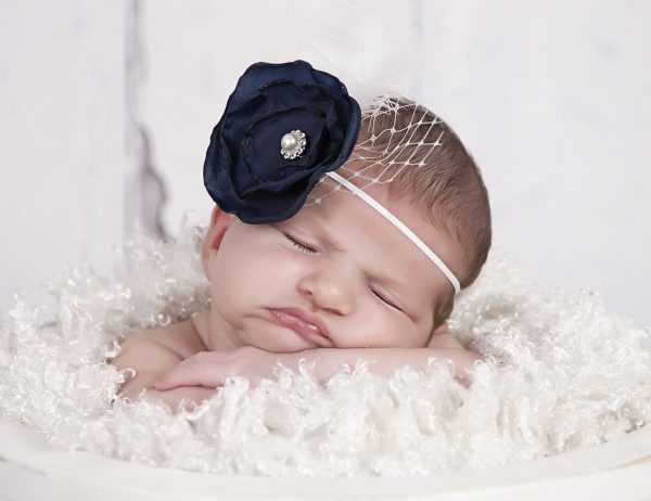 Layered navy satin flower with rhinestone, feather and net on a soft elastic headband