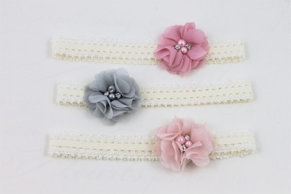 Delicate headband with flower in light pink with pearls and stones