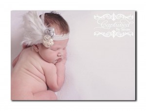 White feather pad, with satin roses, rhinestone and Swarovski crystals on a soft elastic headband