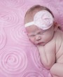 Pink fabric layered flower on delicate ivory elastic headband