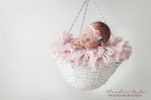 Pink satin rose with guinea feather and rhinestone bow