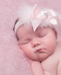 Fluffy headband with a cute pink satin bow decorated with a rhinestone
