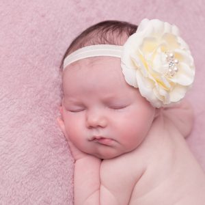 Ivory rose with rhinestone on a soft elastic headband
