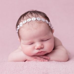Delicate white satin flowers individually decorated with diamante
