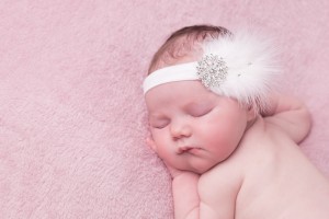 White feather headband with large rhinestone and Swarovski diamante