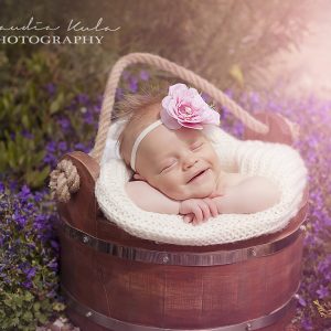 Pink two toned flower with rhinestone and feather