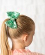 Sequin bow in mint green decorated with Swarovski crystals on a clip