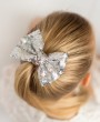 Silver sequin bow on a clip