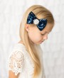 Navy sequin bow decorated with rhinestone on a clip