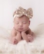 Rose gold sequin bow on a soft headband
