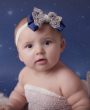 Navy oversized bow with gold lace and pearls on a soft elastic headband