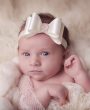 Satin ivory bow with gorgeous rhinestone on soft elastic headband