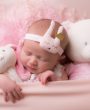 Cute sleeping bunny with gold crown on a soft headband