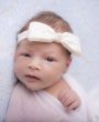 Ivory satin and lace bow with pearl on a soft elastic headband