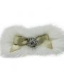 Gold satin bow on a ivory bow with rhinestone on a clip