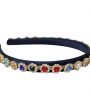 Navy alice band with colourful stones in a gold cased diamante