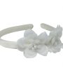Two ivory flowers on an ivory alice band