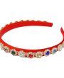 Red alice band with colourful stones in a gold cased diamante