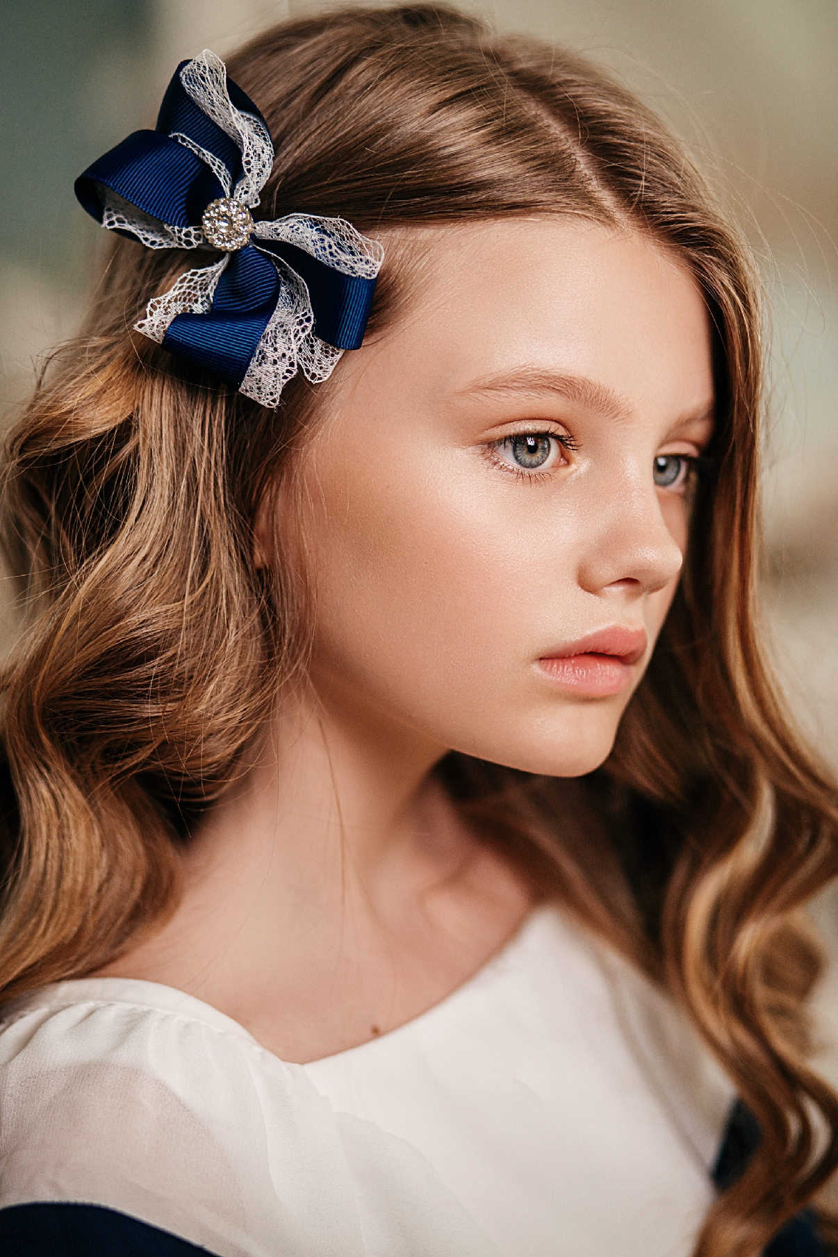 Navy and white lace bow with rhinestone on a clip