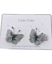Set of two grey butterflies on clips